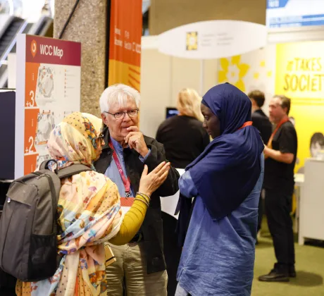 Participants at the 2024 World Cancer Congress meeting in between sessions