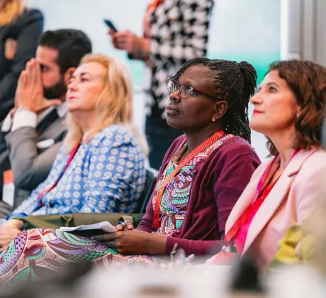 Participants listening at a session at the 2024 World Cancer Congress