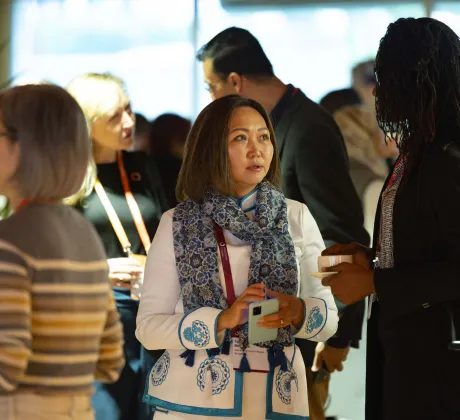 Groups of people interacting at the 2024 World Cancer Congress