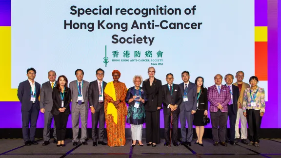 Dignitaries on stage at the 2026 World Cancer Congress during a special recognition of the host organisation, the Hong Kong Anti-Cancer Society