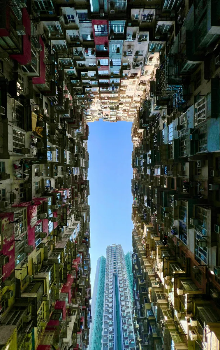 A view of the sky in between apartment buildings in Hong Kong